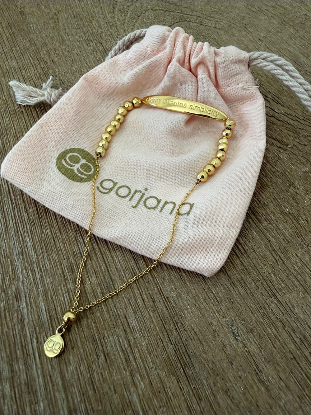 Gorjana Gold Beaded Bar Bracelet with saying: clarity creates simplicity